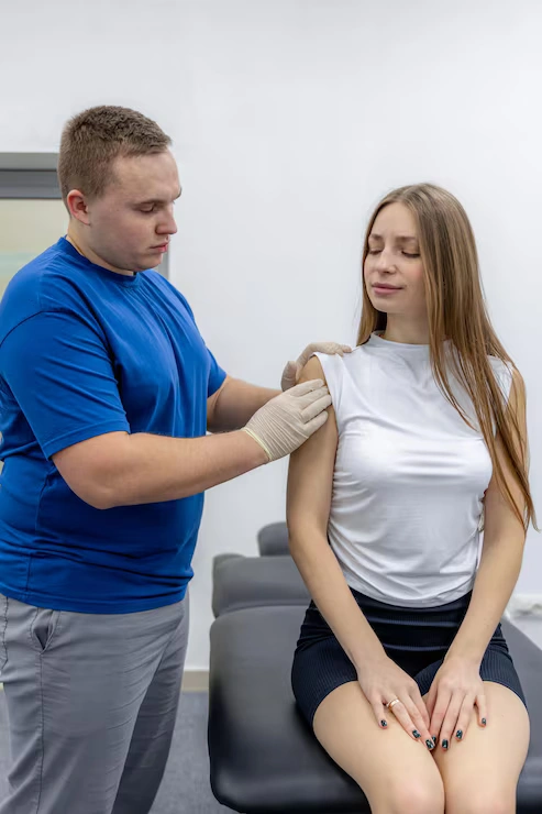 doctor-checks-collarbone-shoulder-female-patient-rehab-pain-assessment_169016-71671