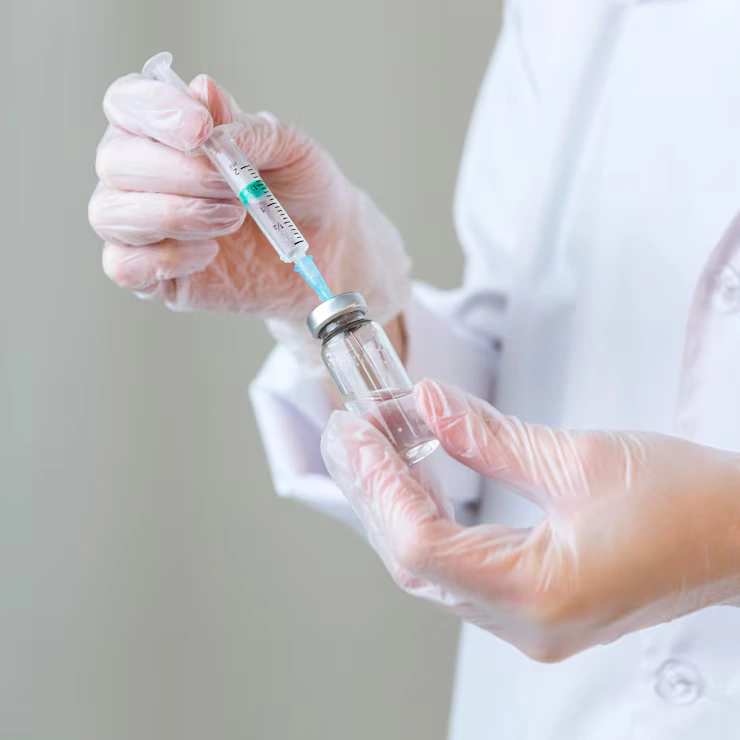 side-view-female-researcher-with-gloves-holding-syringe_23-2148799288